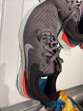Nike Dark Gray Knit Running Shoes with Teal and Orange Accents